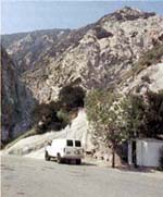 Just around the bend from the dam, the Gulf van is parked near the shed that houses tha Caltech-Gulf monitoring instruments